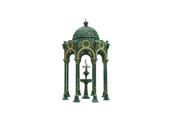 Drinking fountain with intricate details cast in green and gold colours.